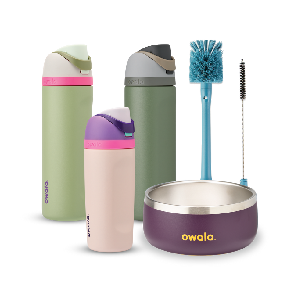 Family Bundle with accessories; two tall FreeSip water bottles in green and pink-mauve, a Kids Tumbler in pink-mauve with teal lid, a purple Pet Bowl with stainless rim, and a blue bottle brush
