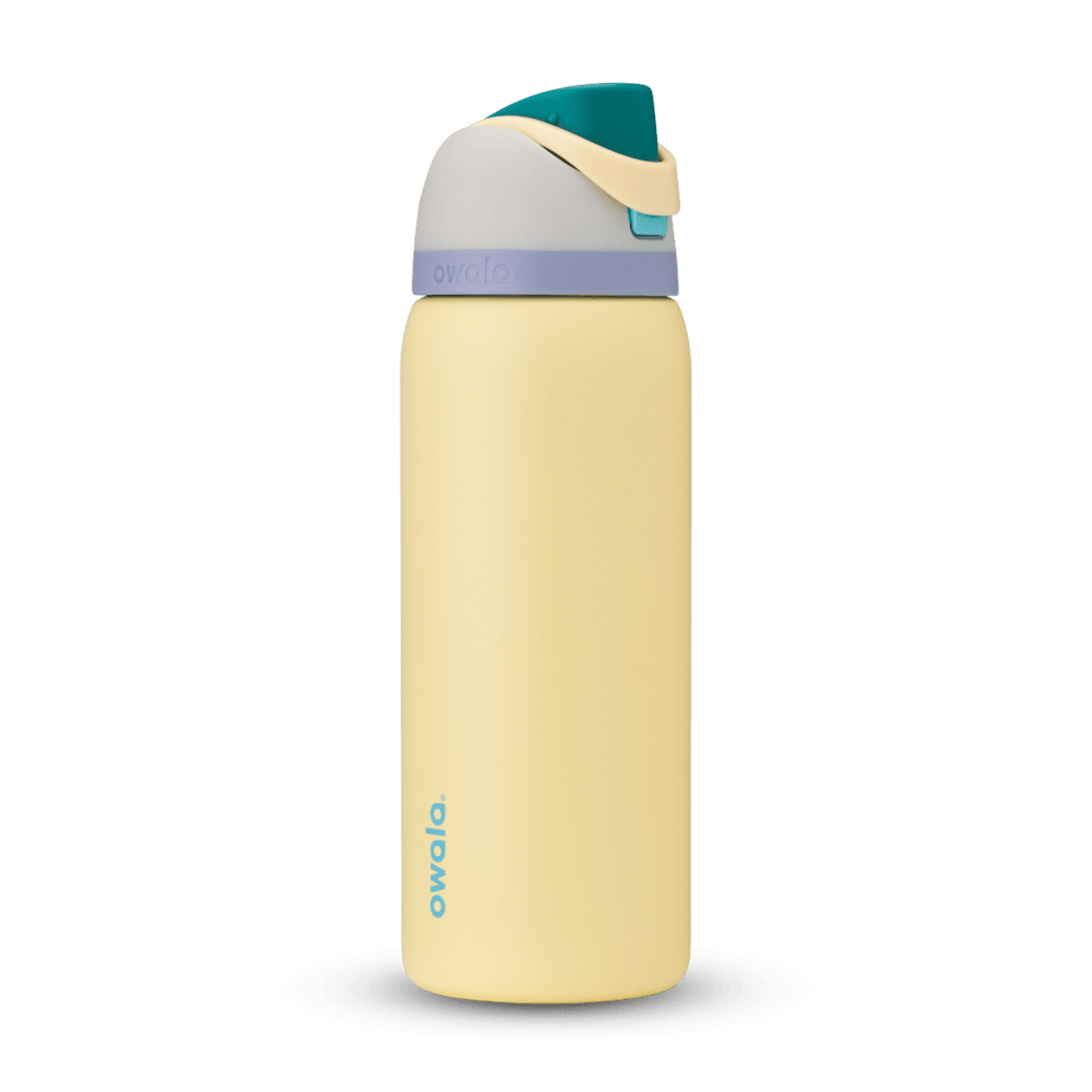 FreeSip 32oz in Sunny Daze, soft yellow body with teal flip cap, cream carry loop, gray lid, and lavender accent band