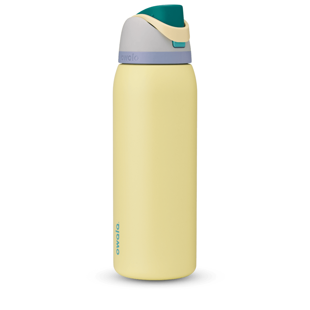FreeSip 40oz in Sunny Daze, soft yellow body with teal flip cap, cream carry loop, gray lid, and lavender accent band