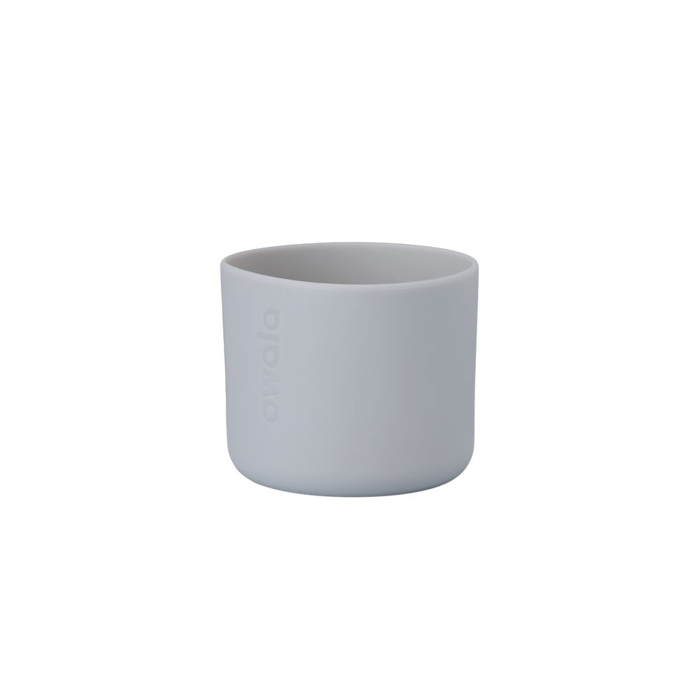 Owala Bottle Boot in soft light gray silicone with tonal Owala logo, short cylindrical form sized for 16oz Kids' FreeSip bottles