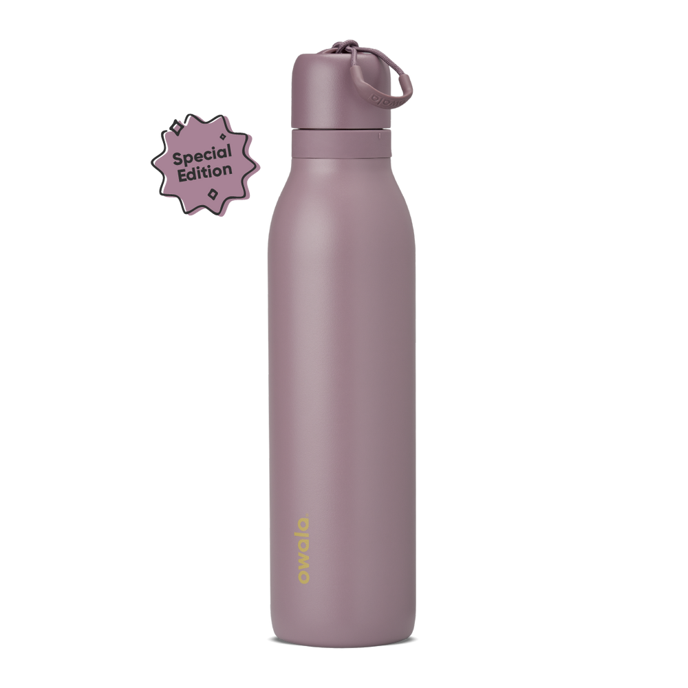 FreeSip Twist 24oz in Spring Revival, dusty mauve-purple insulated bottle with matching twist cap and carry string, gold Owala logo