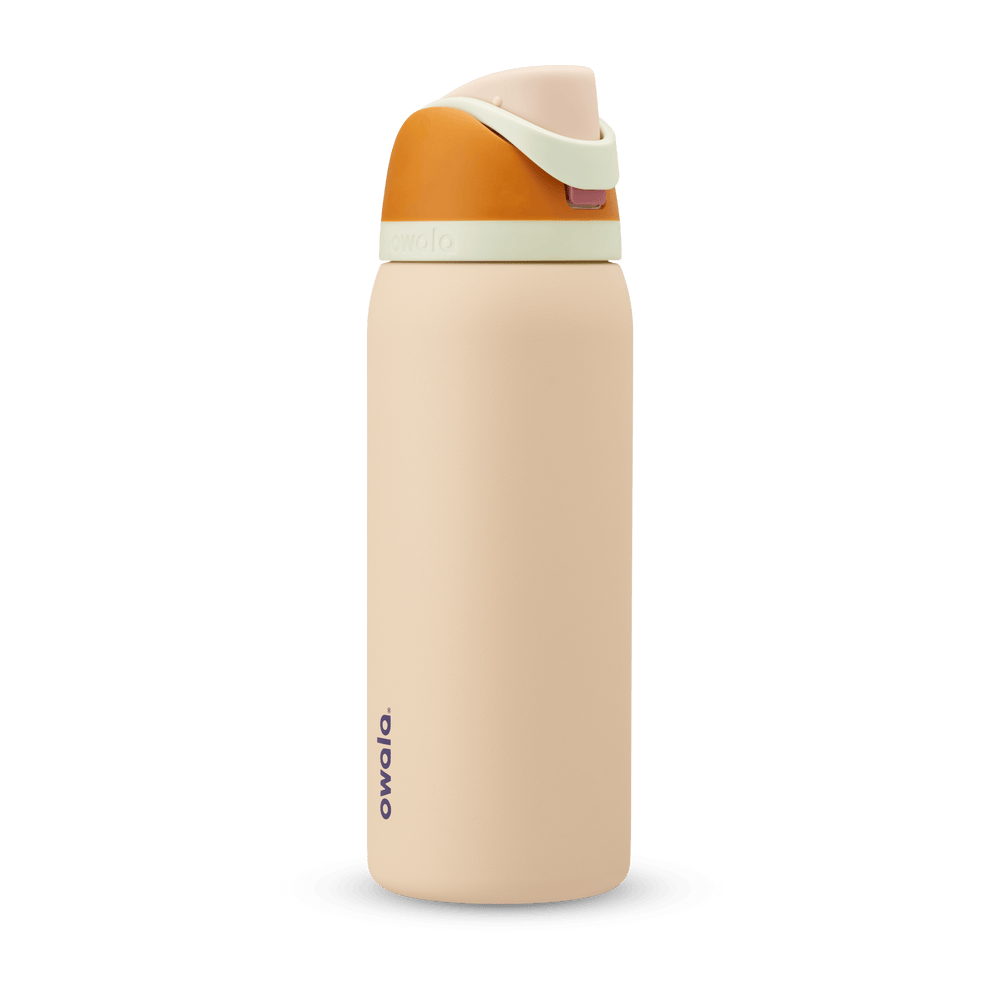 FreeSip 32oz water bottle, warm sandy peach body with golden orange and pale mint color-block flip cap